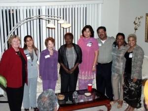 Mohinder Mann and his wife, Robina Mann (to his right), have a photo with community advocate-friends
