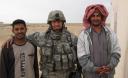 Major Ian Tudlong and some Iraqi locals